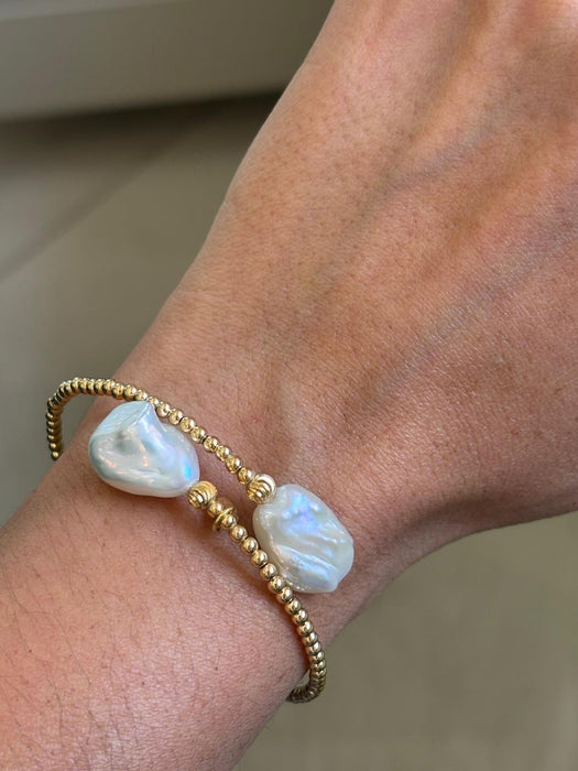Aro flexible oro 18k con perla barroca natural