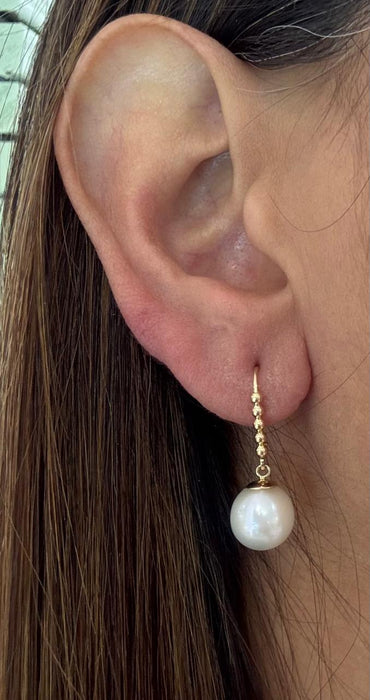 Arete largo oro 10k con perla natural cultivada